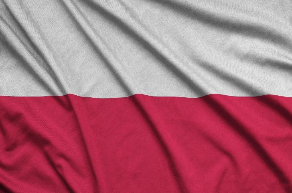 Poland flag is depicted on a sports cloth fabric with many folds. Sport team waving banner